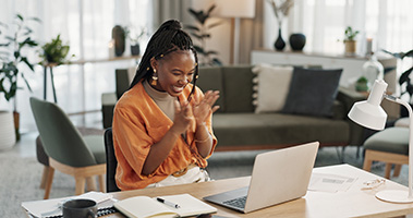 woman-happy-at-laptop-promo-card-incentive.jpg