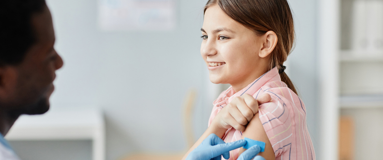 teen girl getting a vaccine