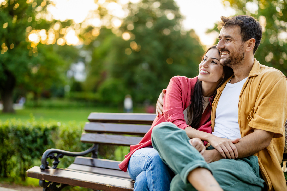 young couple on a park bench