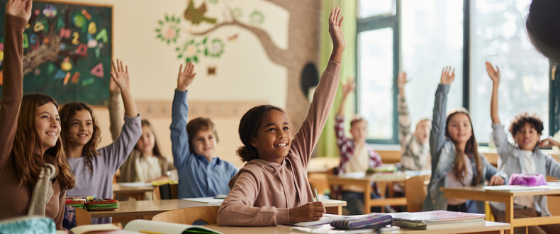 students raising hands