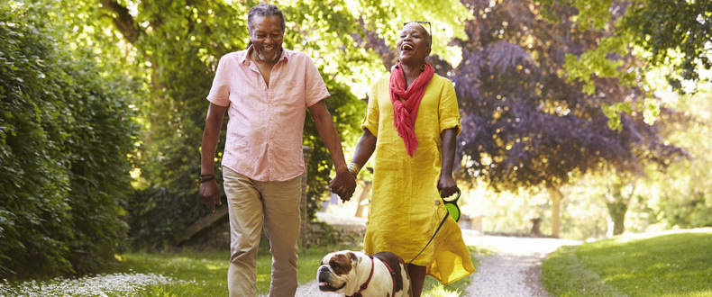 Couple walking dog