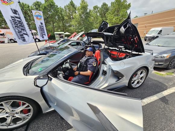 Martrice Chaviest, security officer at Sentara Princess Anne Hospital, checks out the corvettes before getting a prostate cancer screening.