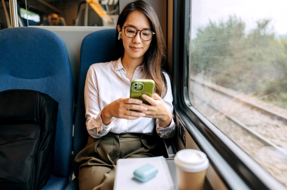 Woman on train texting