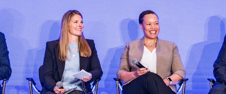 Joanne Inman (left) and Dana Weston Graves speak with peers at a Sentara leadership retreat meeting in April 2026
