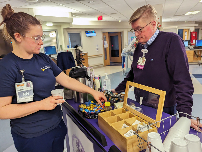 Sentara nurse talks to hospital chaplain at Lavender Cart.jpeg