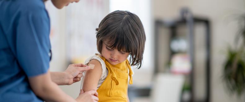 little girl getting vaccine