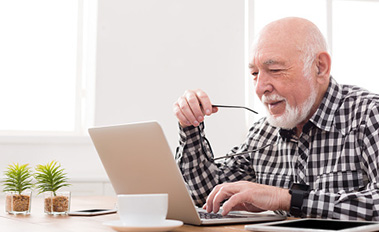 Older man on laptop