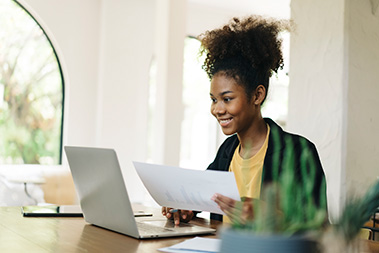 young-woman-smiling-at-laptop.jpg