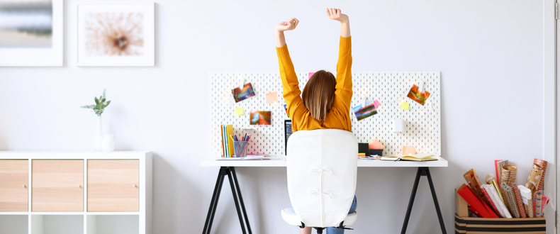 woman stretching at her desk