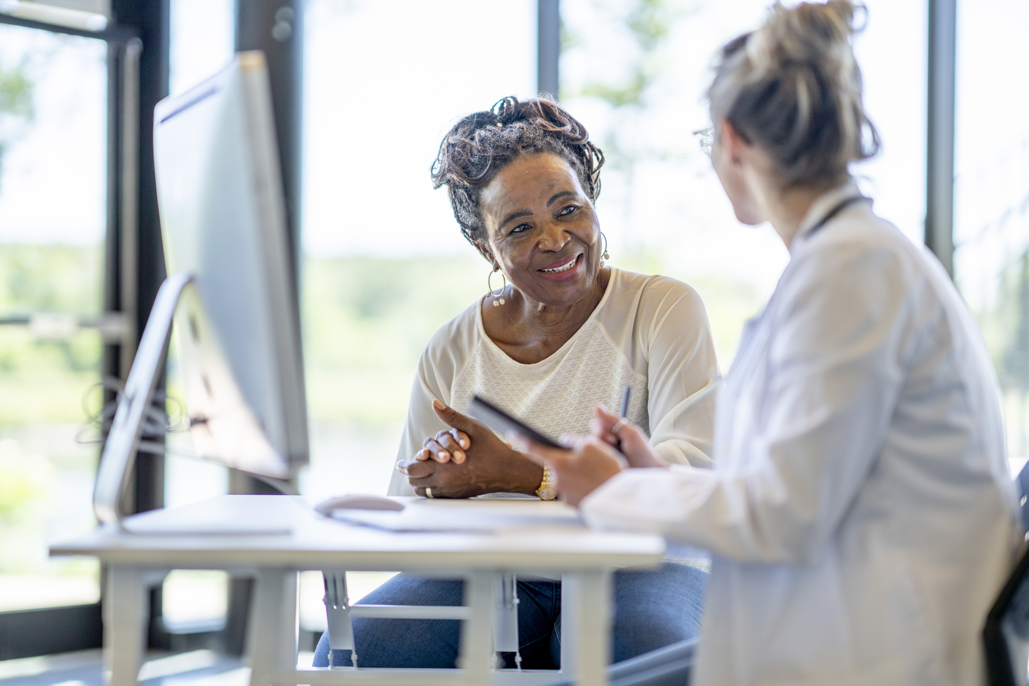 woman talking to female doctor