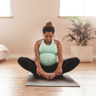 pregnant woman doing yoga