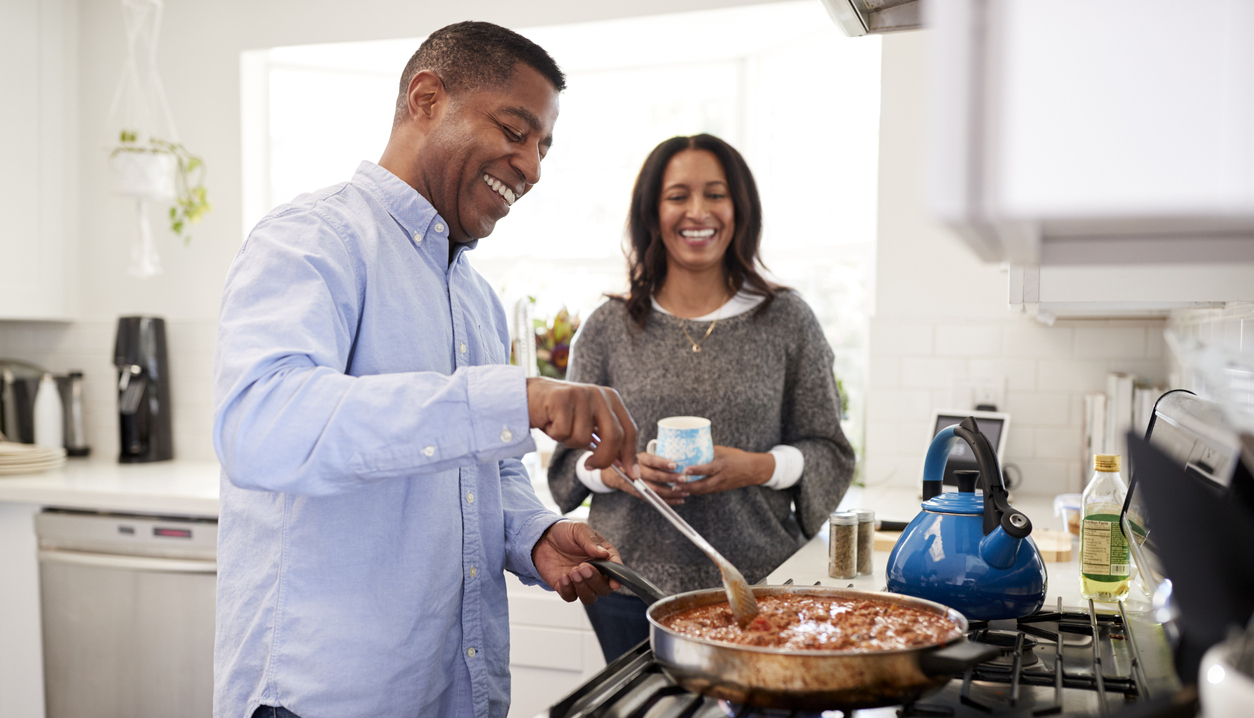 Couple cooking at stove