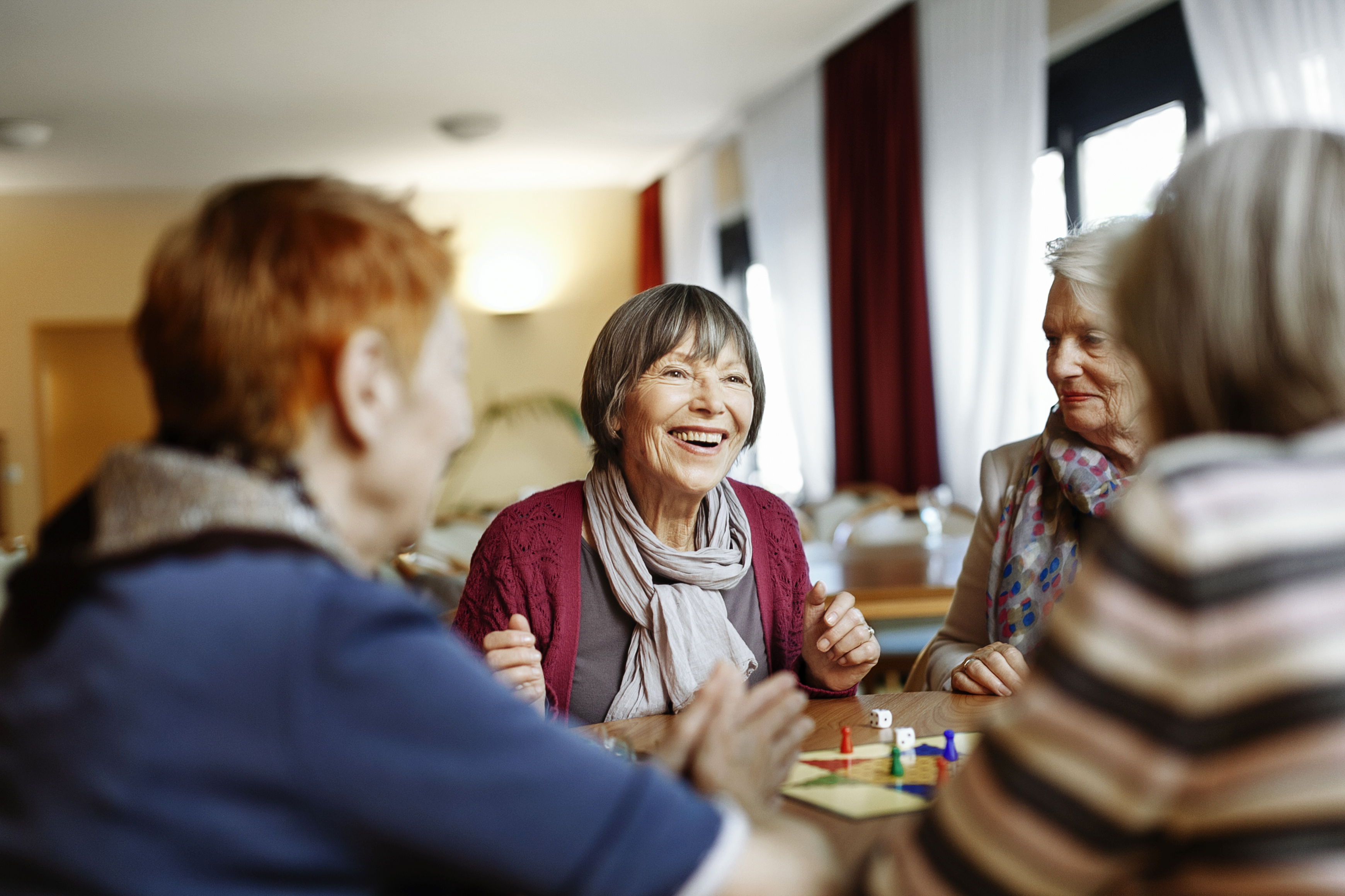 senior friends dining together