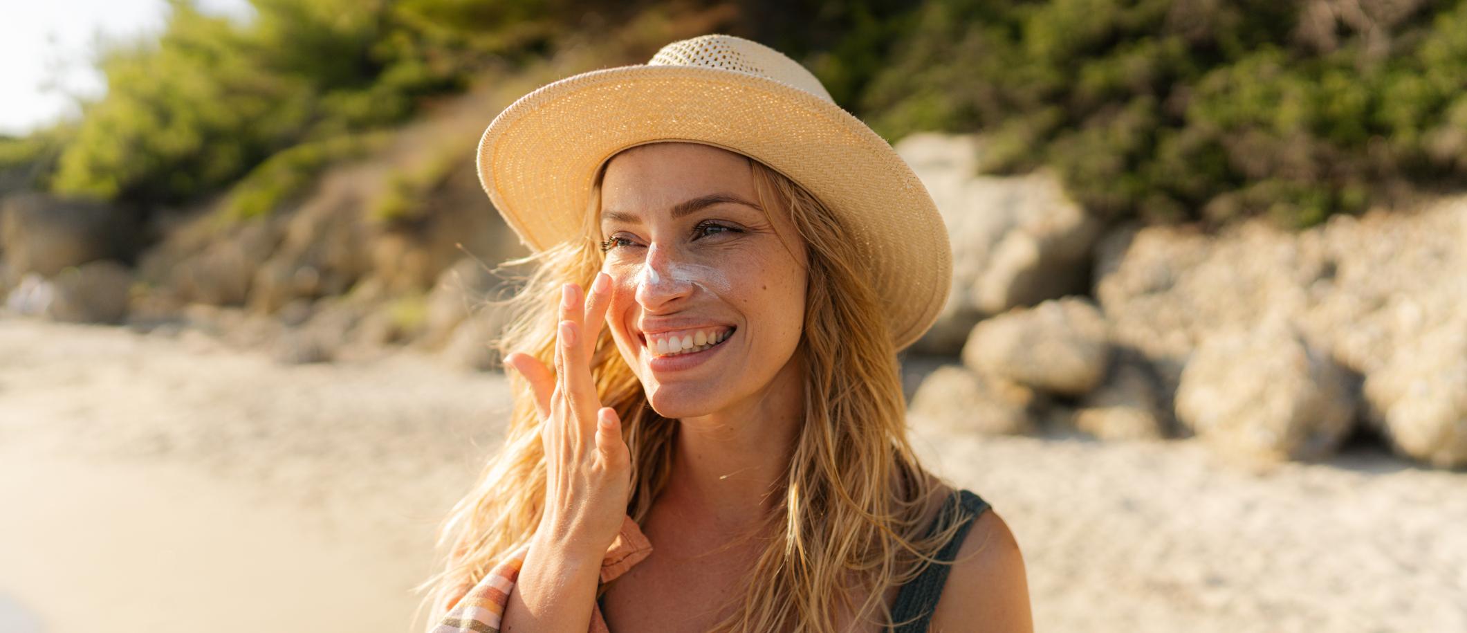 woman applying sunscreen