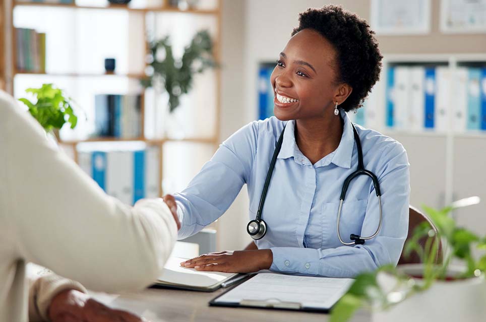 smiling provider shaking hands