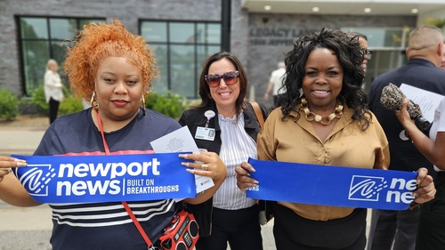 Resident and others celebrate Legacy Landing grand opening.jpg