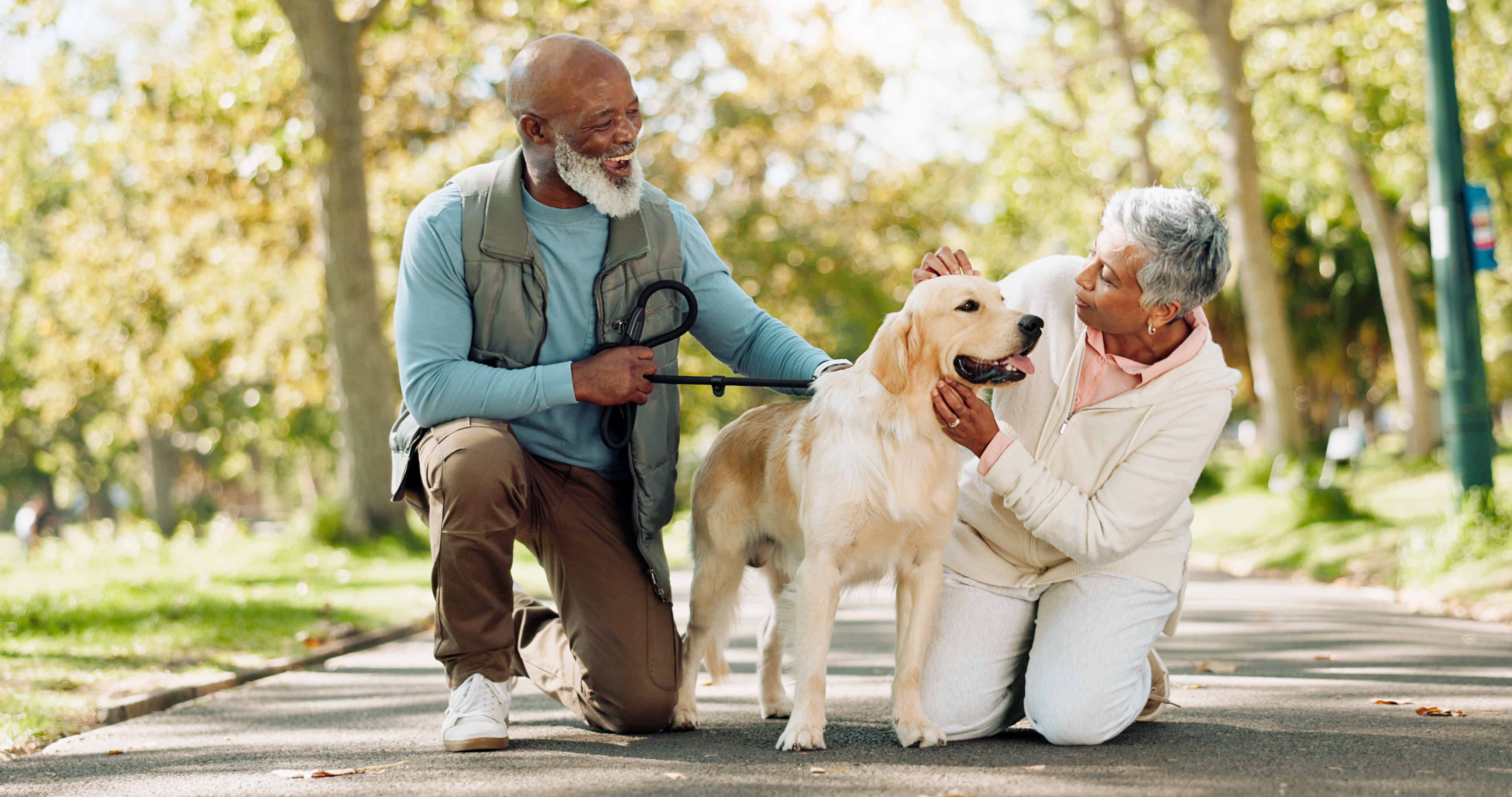 couple petting dog