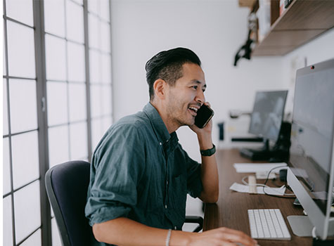 Man in office on his phone