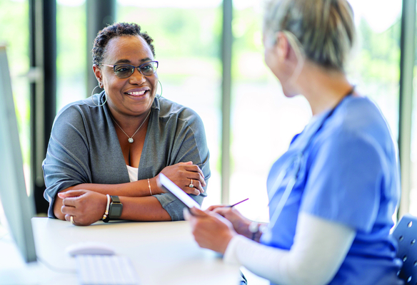 woman talking to doctor