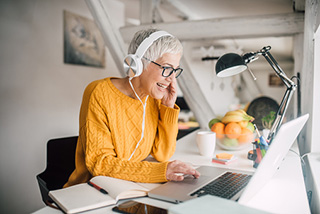 woman-with-headphones-and-laptop.jpg