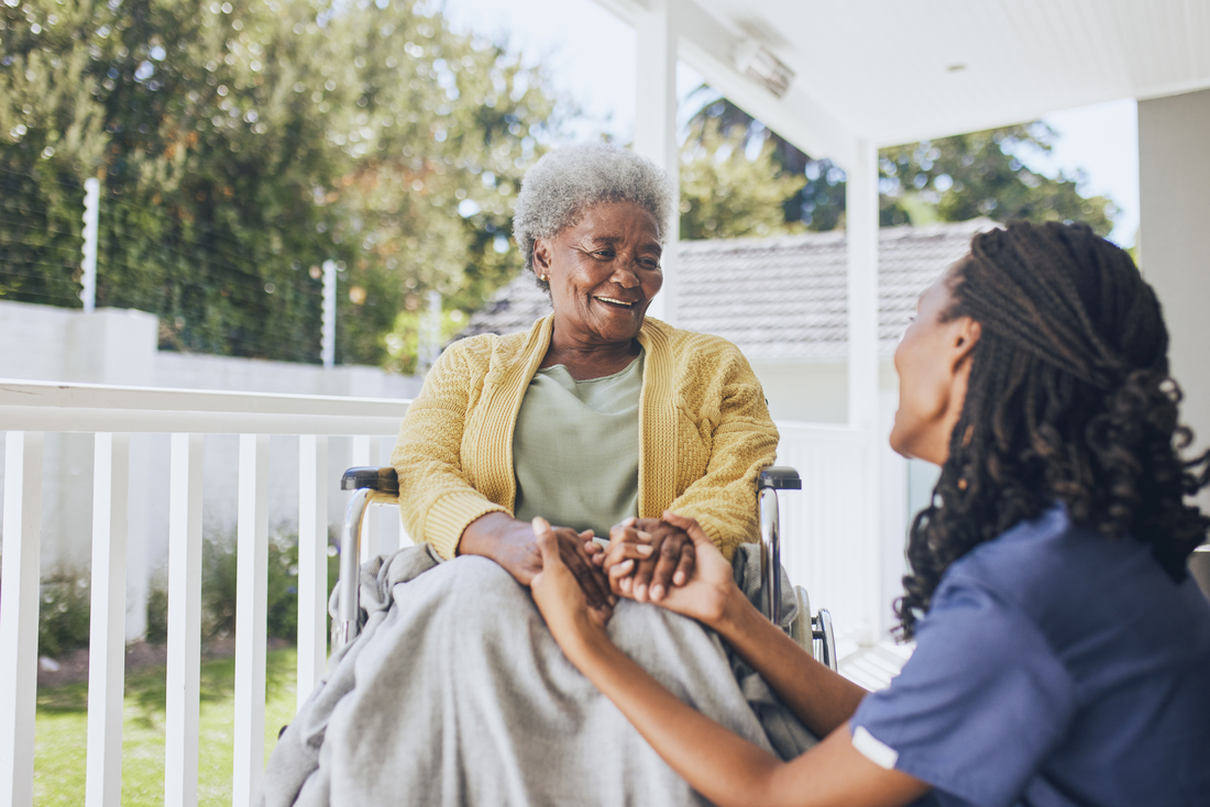 elderly woman on porch with home nurse