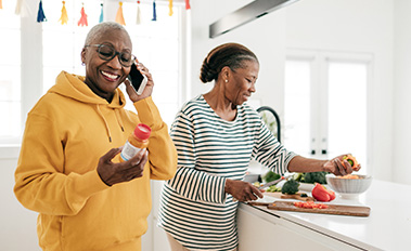Woman on phone with prescription bottle
