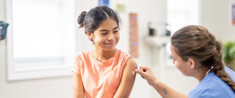 teen girl getting vaccine