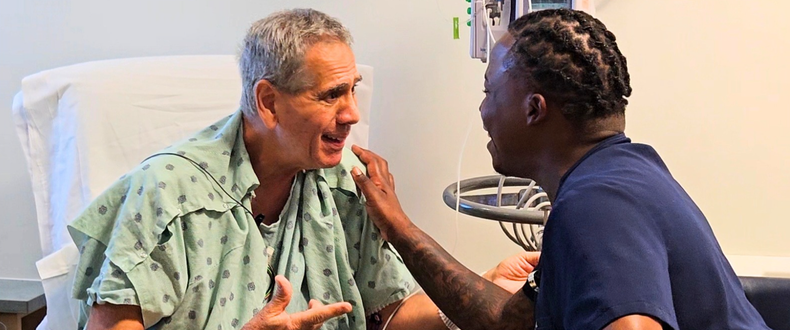 Patient Benny Brocato (left) and his nurse, Willie Scott, enjoy conversation at Sentara Virginia Beach General Hospital. 