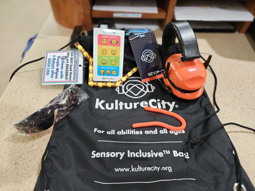 A sensory inclusion bag at Sentara includes noise-reducing headphones, fidget tools, visual cue cards, and weighted lap pads.