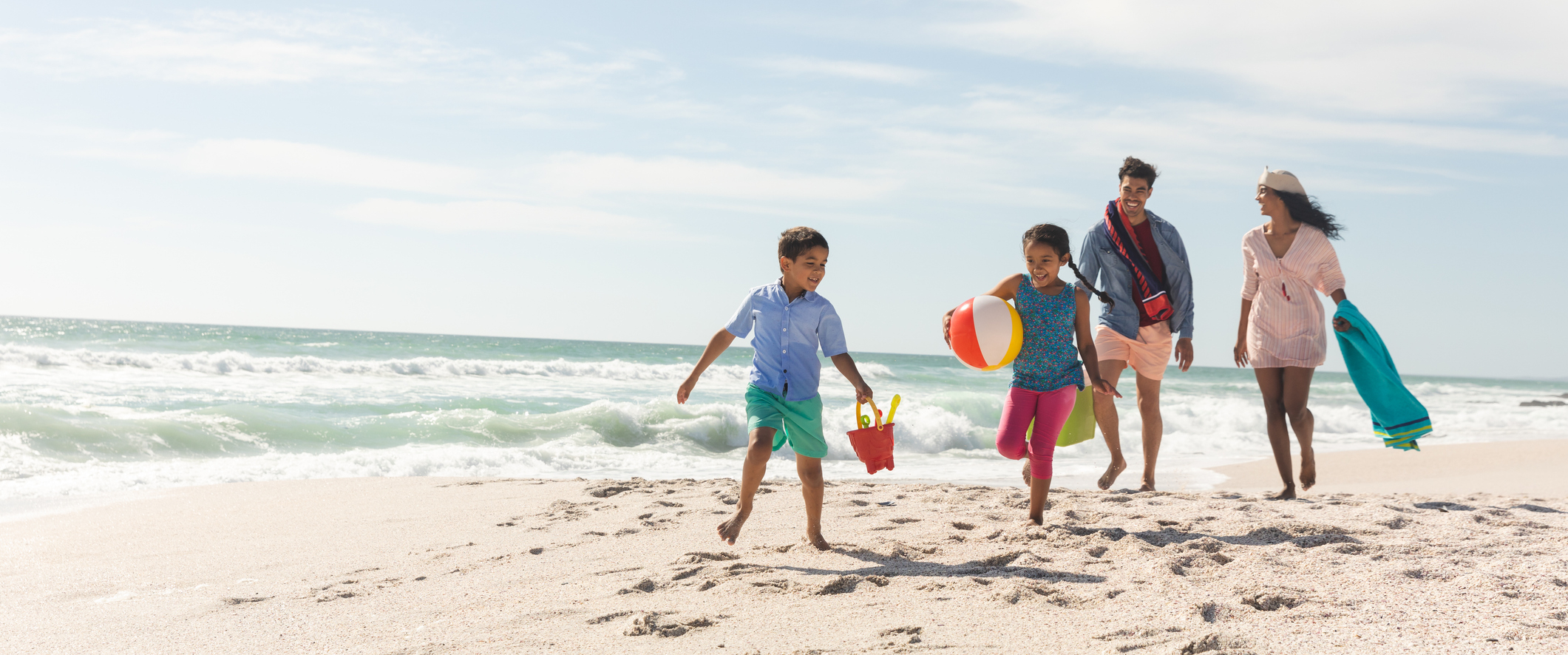 family walking on the beach