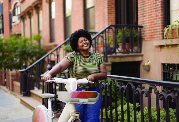 woman walking with bike