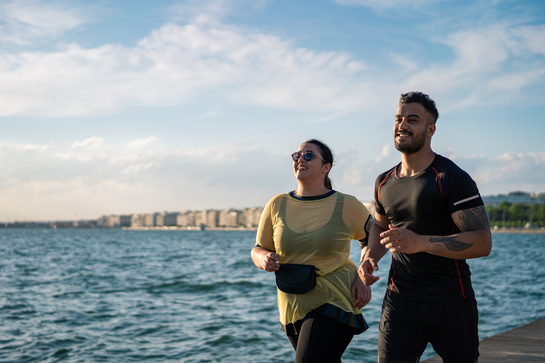 woman running with her trainer
