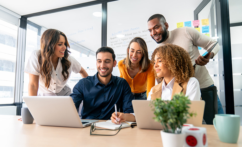 employees-meeting-around-laptop.jpg