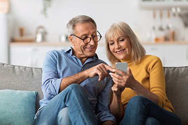 man-smiling-at-tablet.jpg