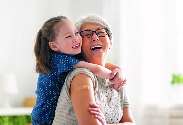 granddaughter hugging grandmother