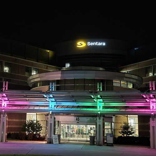 Sentara Williamsburg Regional Medical Center illuminated the front entrance of the hospital in teal, pink, and green lights, the colors representing the metastatic cancer community. 