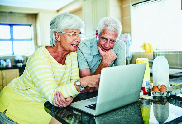 older couple looking at a computer screen