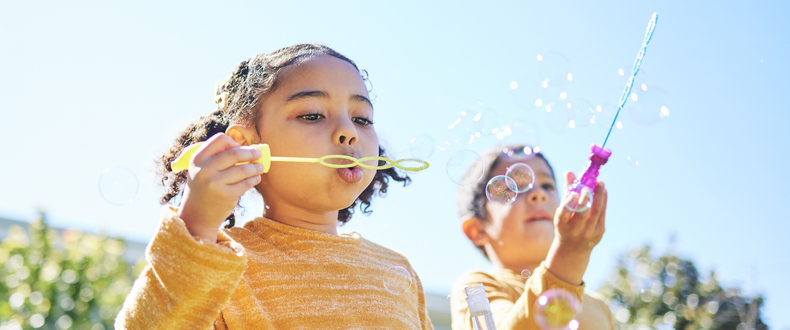 kids blowing bubbles