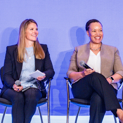 Joanne Inman (left) and Dana Weston Graves speak with peers at a Sentara leadership retreat meeting in April 2026