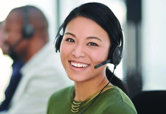 smiling woman with a headset on