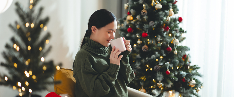 relaxing by a Christmas tree