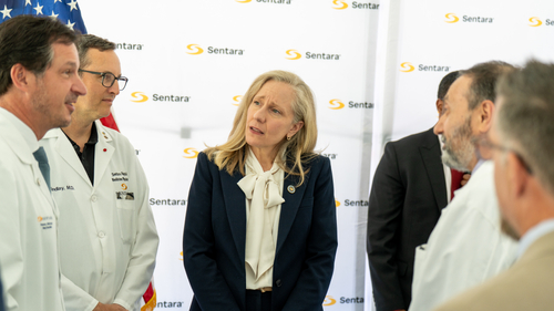 Virginia Gov. Abigail Spanberger speaks with Sentara physicians and leaders in front of a Sentara backdrop at the ceremonial signing of the Protecting Healthcare Workers Act at Sentara Norfolk General Hospital, Thursday, June 4, 2026.