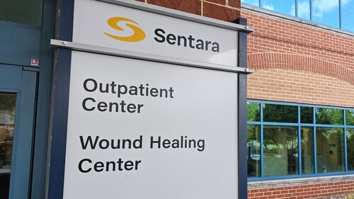 Sentara Outpatient Center and Wound Healing Center exterior sign on a medical building