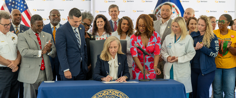 Virginia Gov. Abigail Spanberger ceremonially signs the Protecting Healthcare Workers Act at Sentara Norfolk General Hospital, Thursday, June 4, 2026, surrounded by Sentara leaders and Virginia legislators.