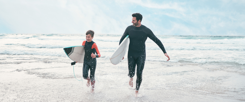 father and son surfing