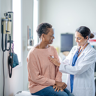 Doctor using stethoscope