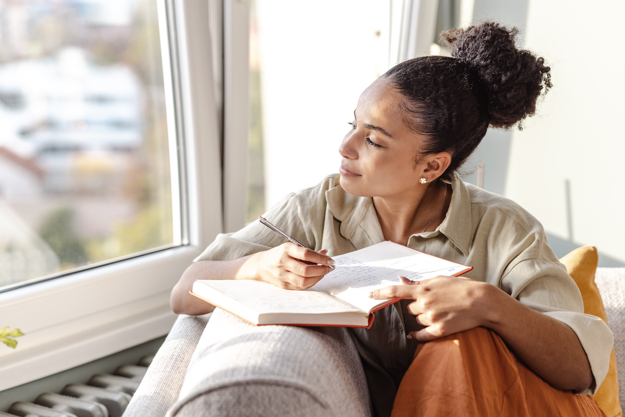 Woman writing in journal