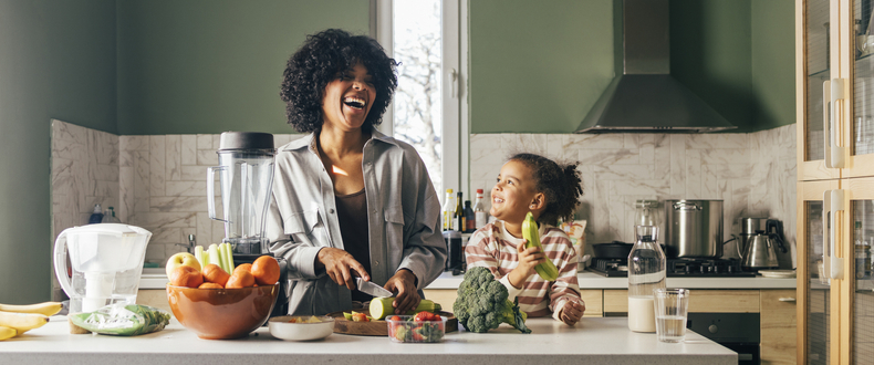 Mother and daughter cooking