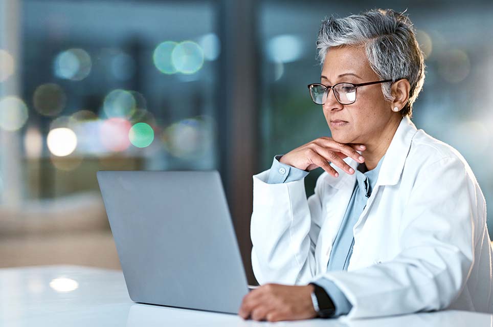 physician looking at computer screen