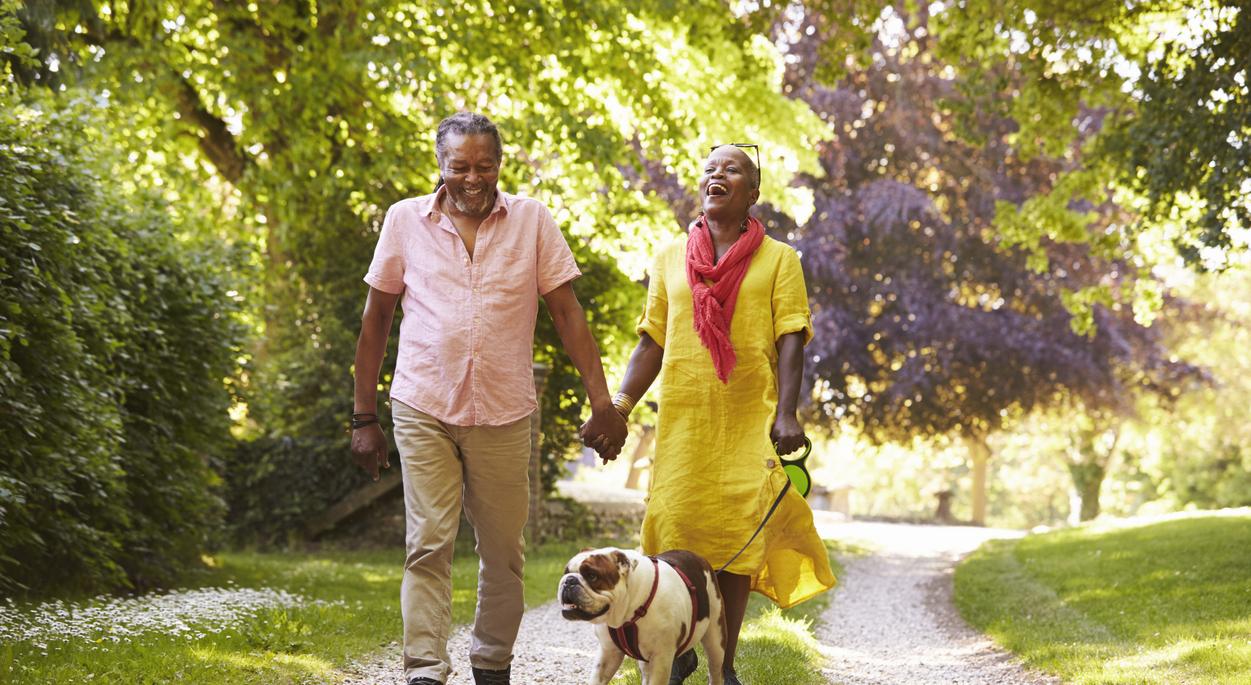 Couple walking dog 